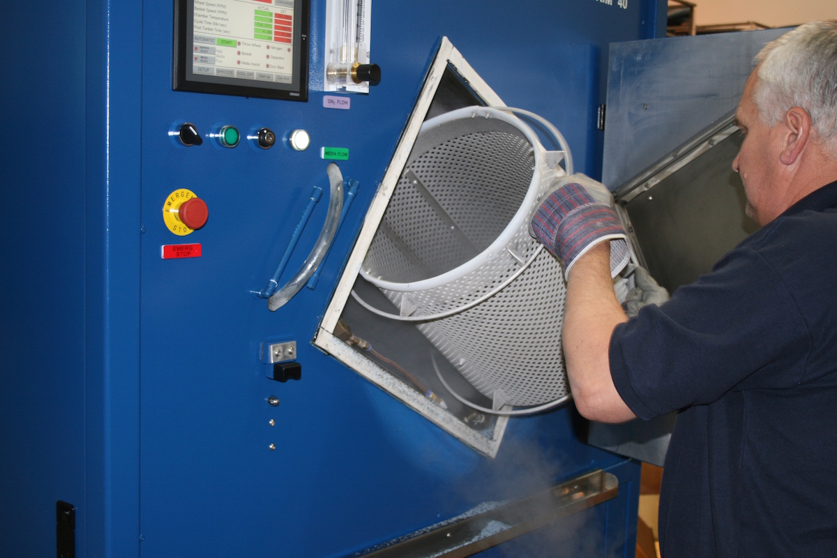 Loading the basket into a Cryogenic Rubber Deflashing Machine